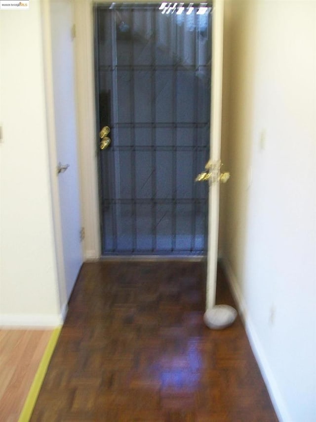 doorway featuring dark hardwood / wood-style floors