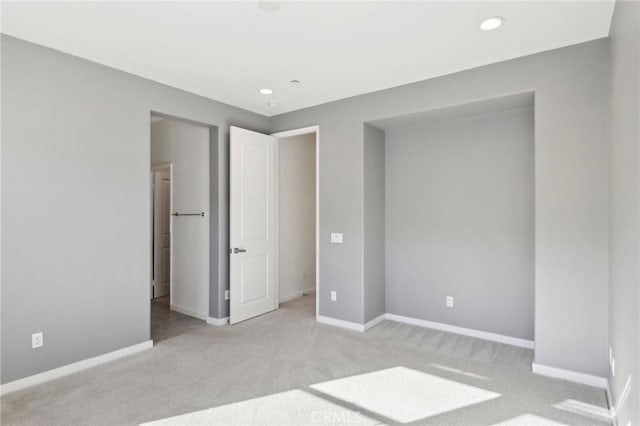 unfurnished bedroom with light carpet