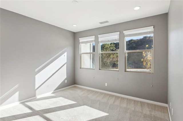 empty room with light colored carpet