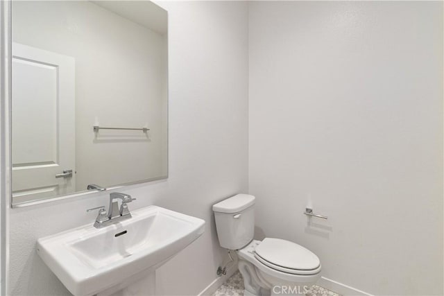 bathroom with sink and toilet