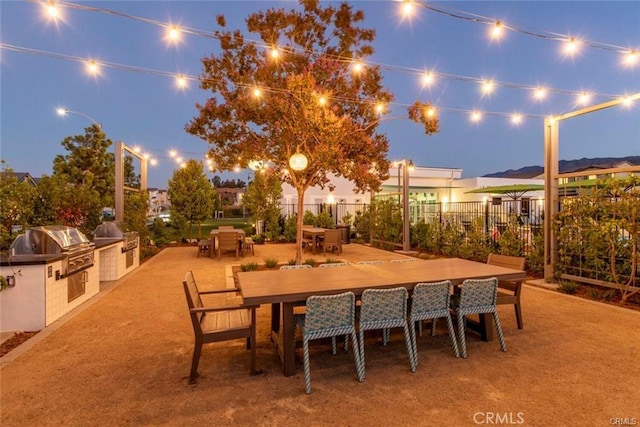 view of patio featuring area for grilling and a grill