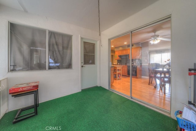 sunroom / solarium with ceiling fan