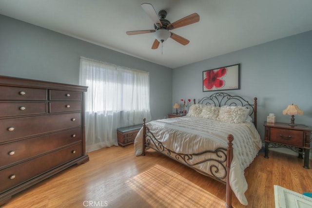 bedroom featuring ceiling fan and light hardwood / wood-style floors