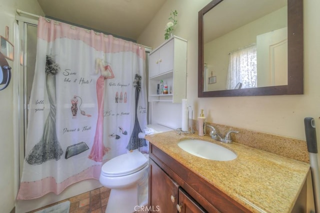 bathroom with vanity, toilet, and a shower with shower curtain