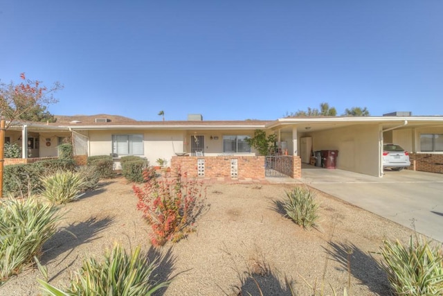 ranch-style house featuring a carport