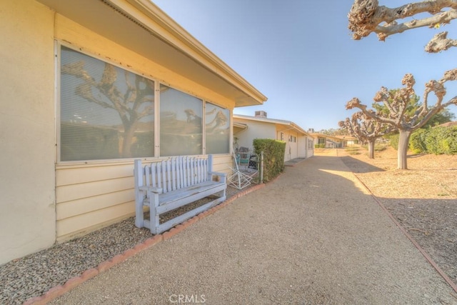 view of side of property featuring a patio area