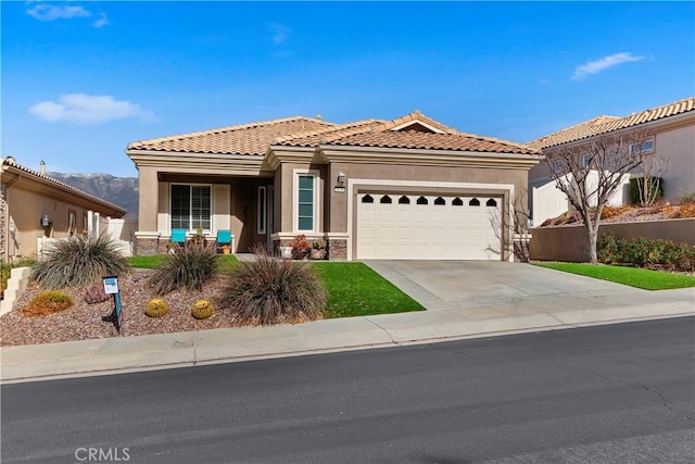 mediterranean / spanish-style home with a garage