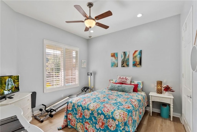 bedroom featuring ceiling fan and light wood-type flooring