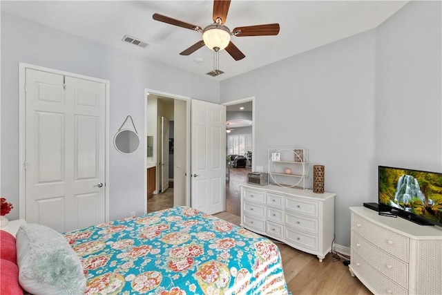 bedroom featuring ceiling fan and light hardwood / wood-style floors