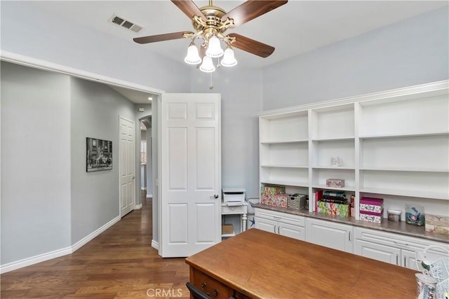 office area with dark wood-type flooring and ceiling fan