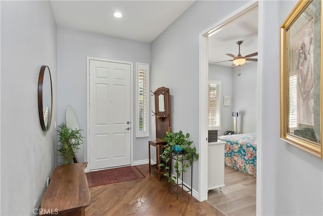 entrance foyer featuring light hardwood / wood-style flooring and ceiling fan