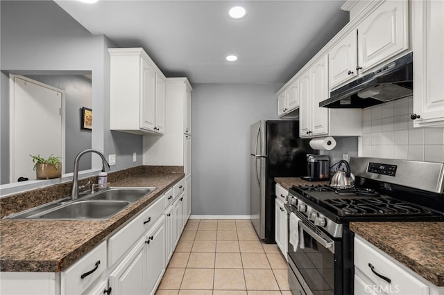 kitchen featuring white cabinets, decorative backsplash, sink, gas range, and light tile patterned floors