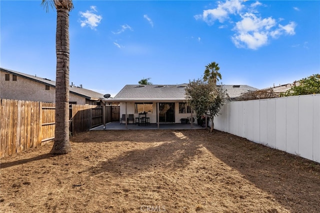 rear view of property with a patio area