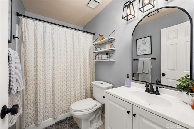 bathroom with toilet and vanity