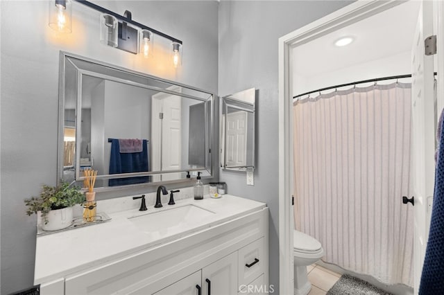 bathroom with toilet, tile patterned flooring, a shower with curtain, and vanity