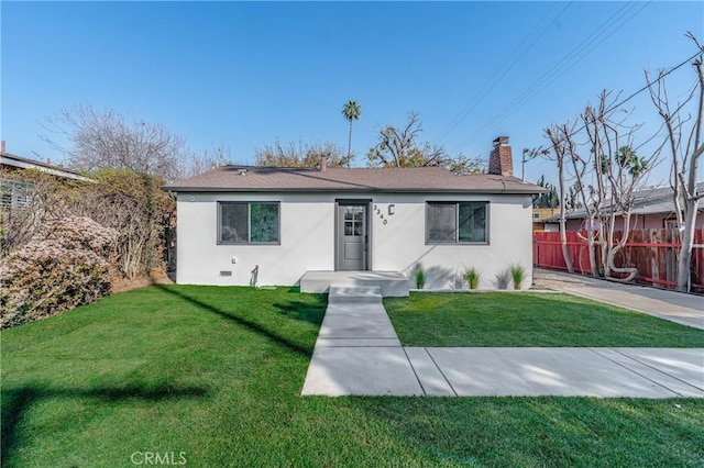 ranch-style house featuring a front lawn