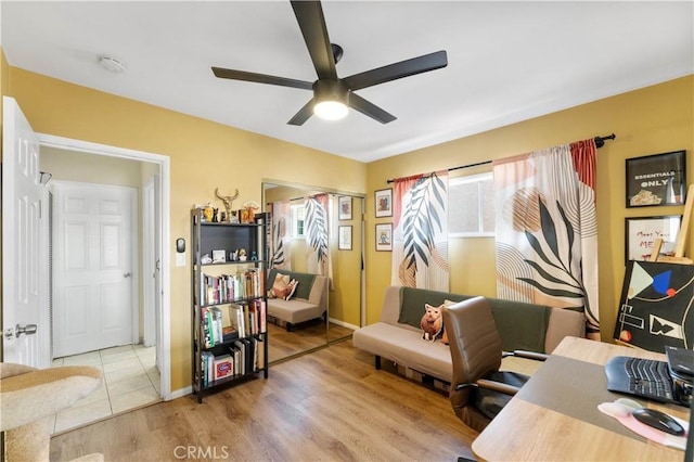 home office with ceiling fan and hardwood / wood-style flooring