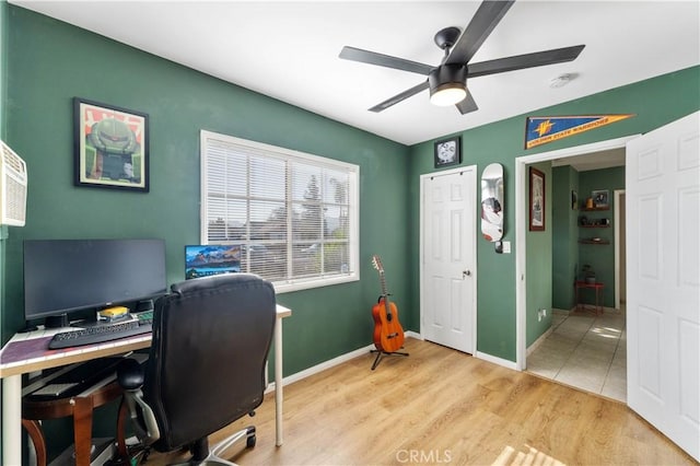 home office featuring ceiling fan and light hardwood / wood-style floors