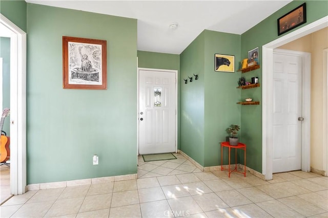 entryway with light tile patterned floors