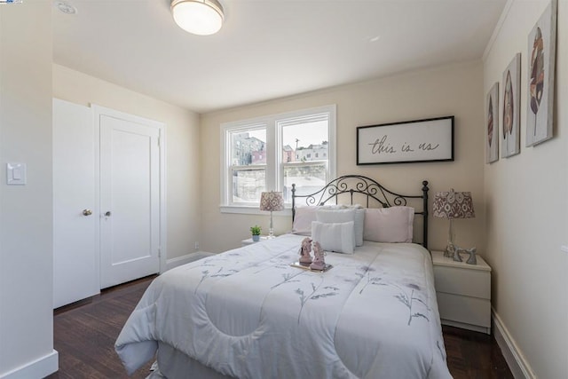 bedroom featuring dark hardwood / wood-style flooring