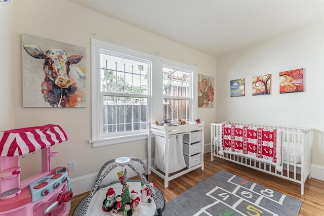 bedroom with hardwood / wood-style flooring