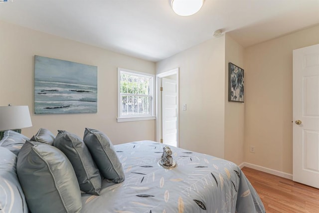 bedroom featuring light wood-type flooring