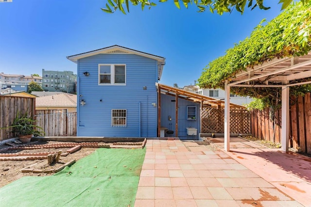 back of house featuring a patio area