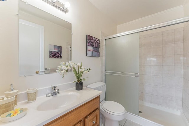 bathroom with a shower with door, tile patterned flooring, vanity, and toilet