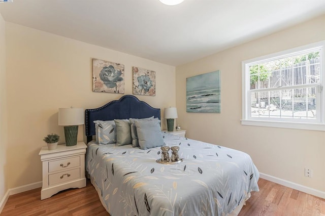 bedroom with light hardwood / wood-style floors