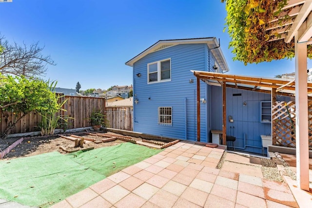 rear view of house featuring a patio area