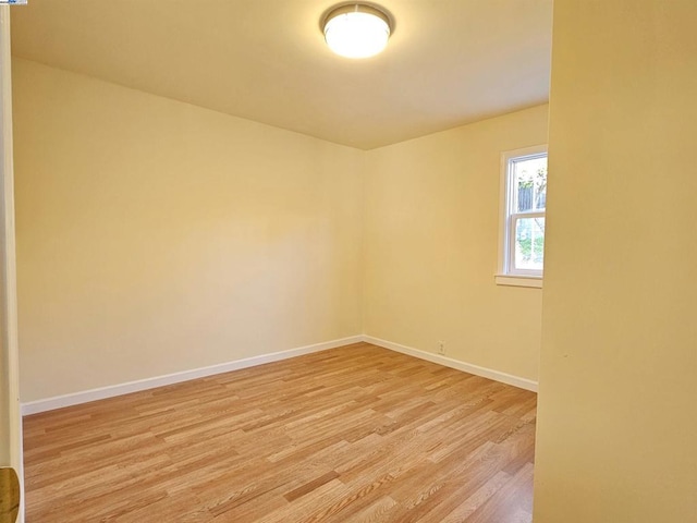 unfurnished room with light wood-type flooring