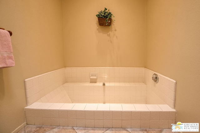 bathroom with tiled tub