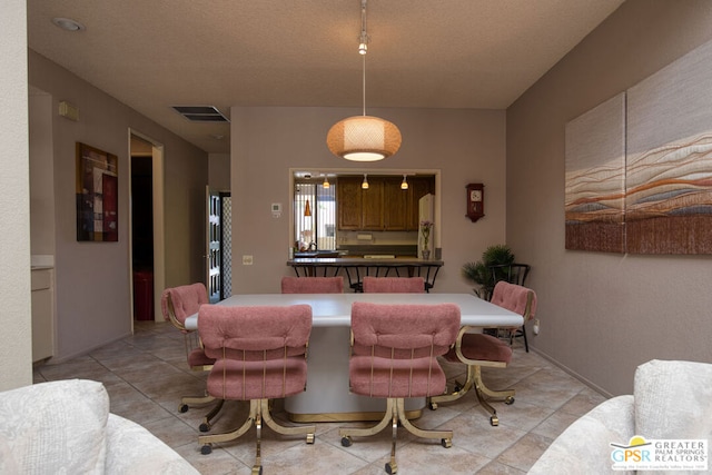 dining area with light tile patterned floors