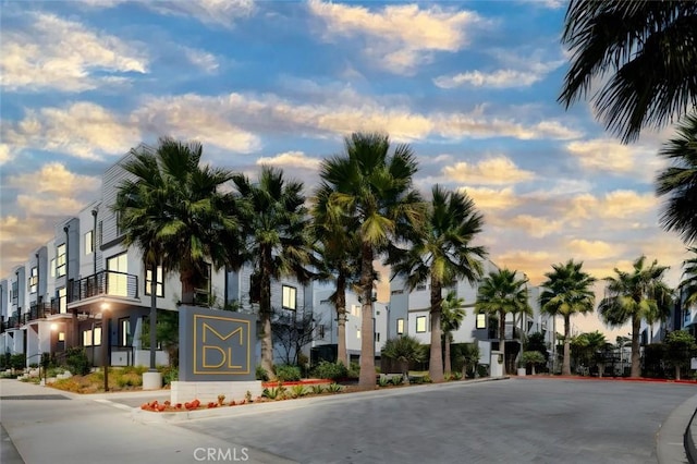 view of outdoor building at dusk