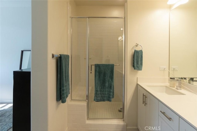 bathroom with vanity and a stall shower