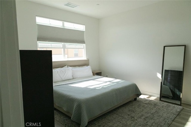 bedroom featuring light wood-type flooring