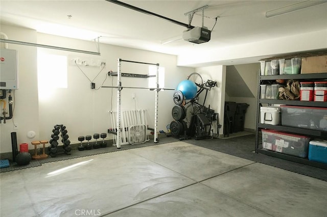 garage with a garage door opener and water heater