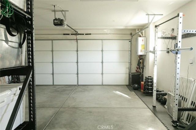 garage with a garage door opener and water heater