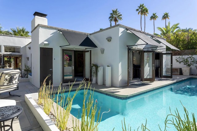 view of swimming pool with a patio