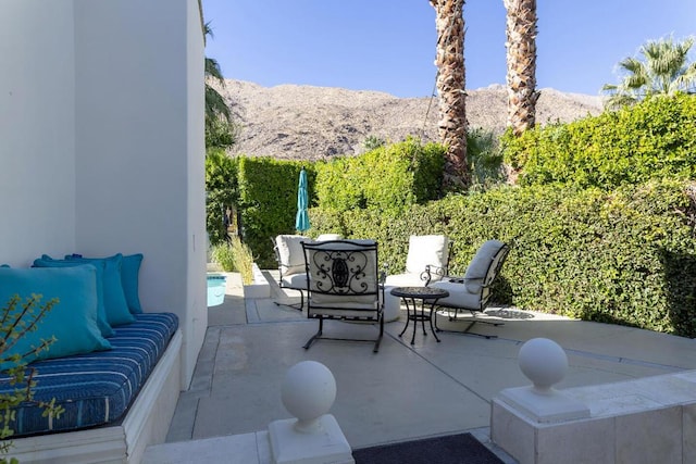 view of patio / terrace with a mountain view