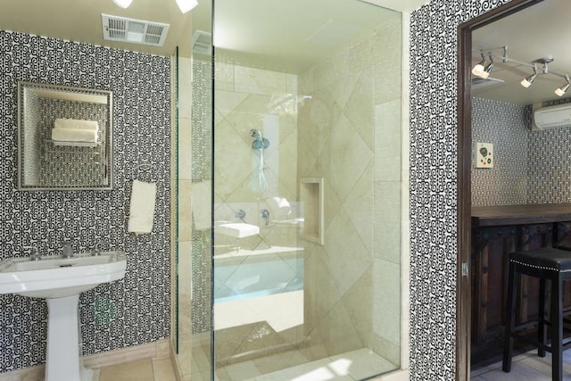 bathroom featuring a shower with door and a wall unit AC