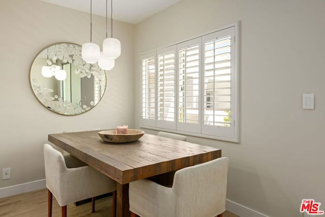 dining room with wood-type flooring