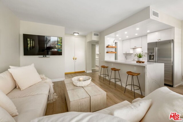 living room with light hardwood / wood-style floors