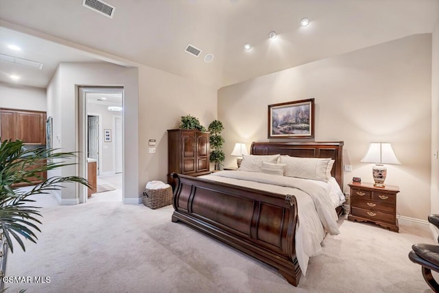 carpeted bedroom with vaulted ceiling