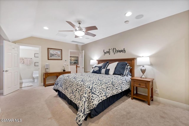 bedroom featuring light carpet, ceiling fan, vaulted ceiling, and connected bathroom