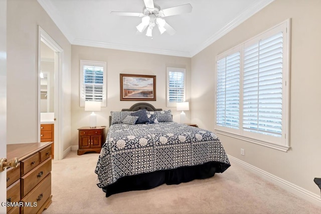 carpeted bedroom with ceiling fan, crown molding, and ensuite bath