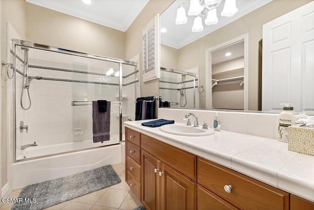 bathroom with vanity, tile patterned flooring, shower / bath combination with glass door, and ornamental molding