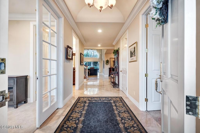 hall featuring a chandelier and ornamental molding