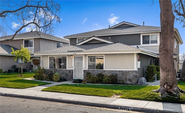 front facade with a front yard