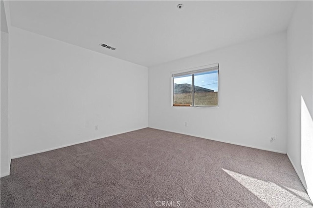 unfurnished room featuring carpet